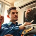 Providing ac repair phoenix az solutions with professional HVAC technician at work in a home.